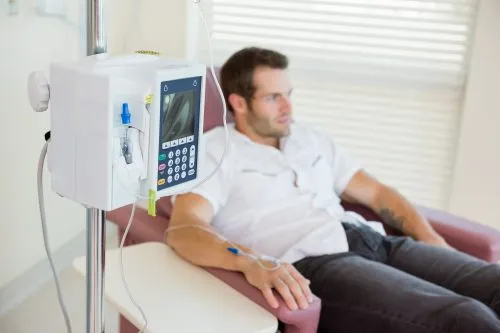 A patient receiving an intravenous nutrient infusion